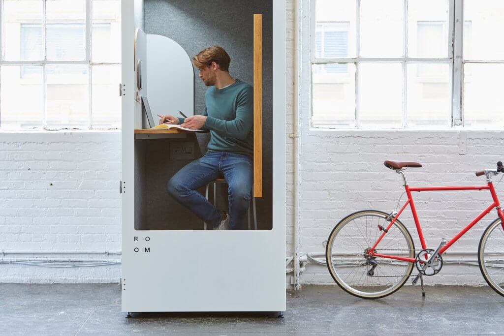 AI Recruitment 4 candidate doing a video interview in a phone booth