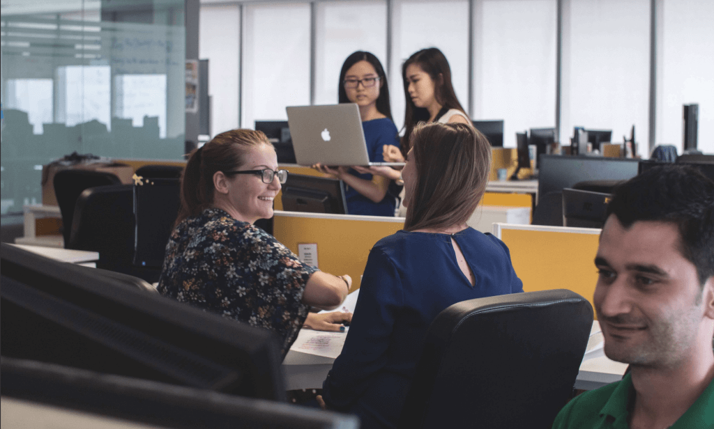 Should psychometric assessments be used for hiring? 4 Group of co-workers in an open office