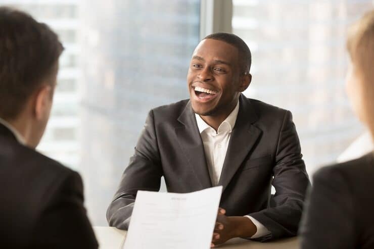 How To Conduct Peer Interviewing and Why You Should Use It 1 Employees interviewing a candidate