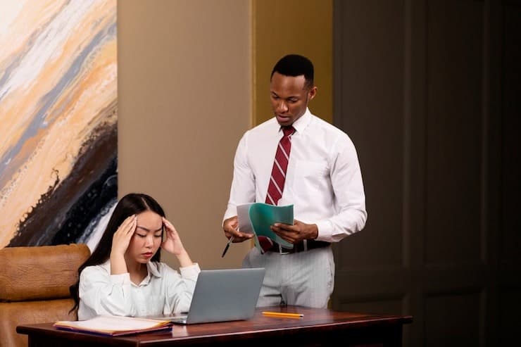 How To Conduct Peer Interviewing and Why You Should Use It 3 A stressed woman in an office