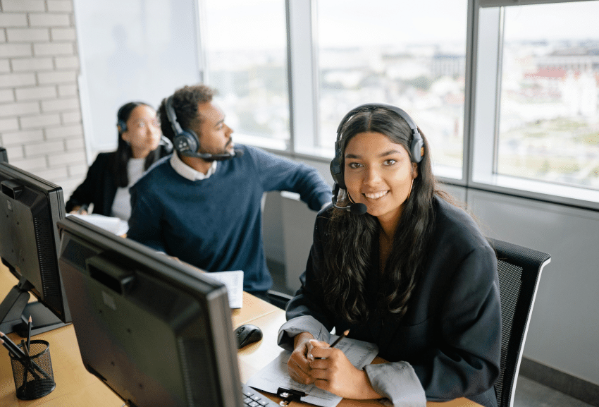 Optimizing Contact Center Recruitment: Leveraging Virtual Job Tryouts for Volume Hiring 7 Woman in call center smiling
