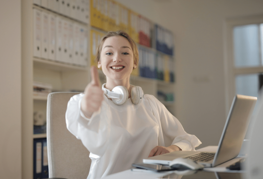 AI Recruiting 101: A Beginner’s Guide to Improving Your Hiring Process 8 Office woman giving a thumbs-up