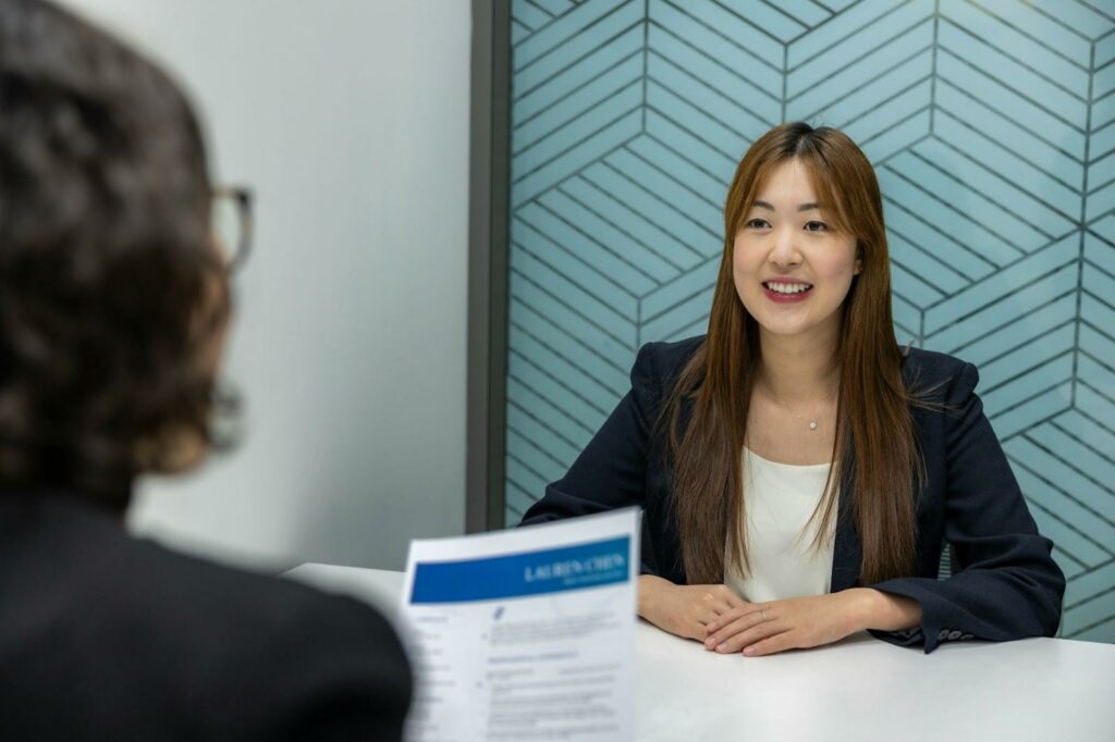 The Top 10 AI Recruitment Tools to Attract the Best Candidates 9 A hiring manager interviewing a candidate