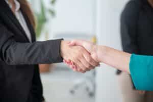 Recruiter sharing a handshake with a candidate