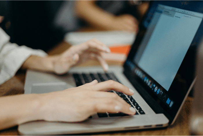 AI Recruiting 101: A Beginner’s Guide to Improving Your Hiring Process 3 Person using laptop
