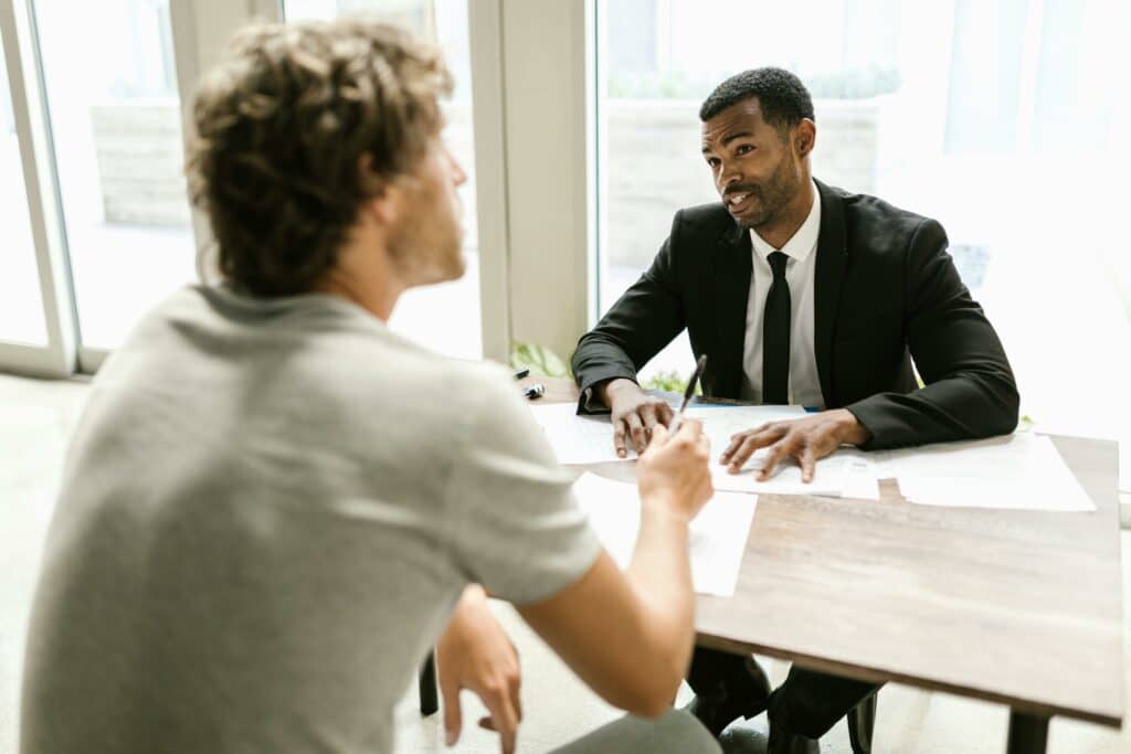 The Rise of Fake Employment References and How to Address Them 12 A man screening a candidate