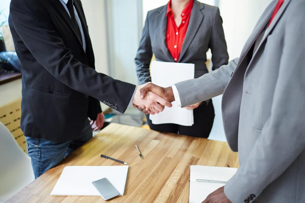 Setting the Foundation: Preboarding Employees for Success 11 Two women shaking hands