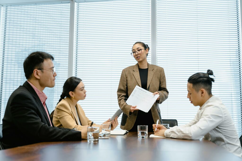 10 Recruiting KPIs to Align Your Hiring Goals 4 Hiring team in a meeting