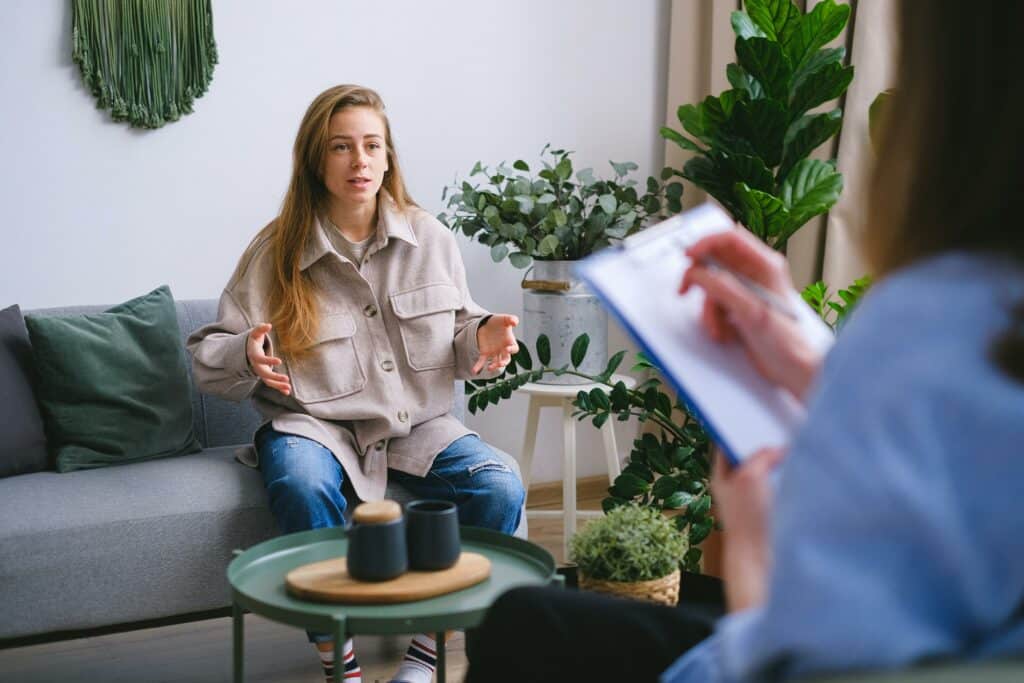 How To Use the STAR Method Interview Questions to Find the Perfect Candidate 8 Woman grading a candidate in an interview