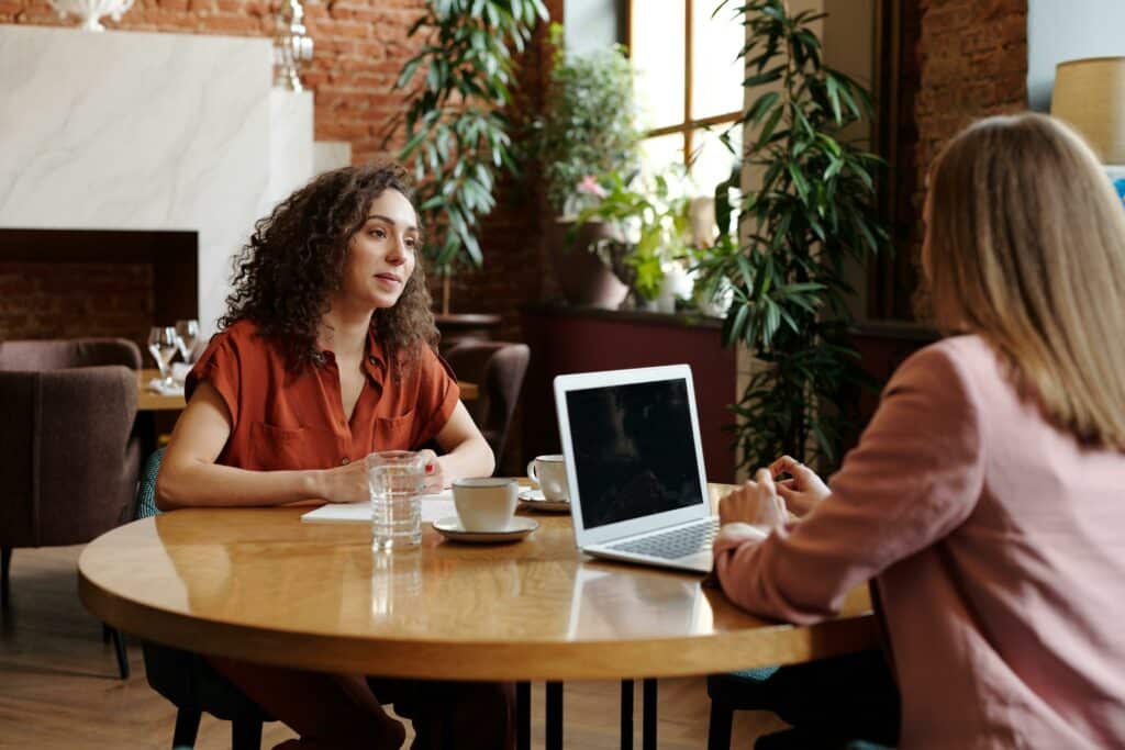 Marketing Interview Questions to Find Your Next Marketing Leader 3 A woman in a job interview