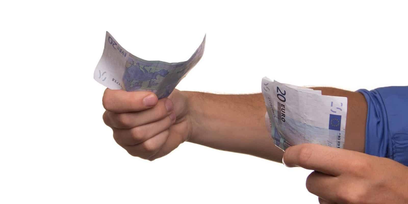 How Testing for Niche Skills Can Help You Hire for Specialized Roles 3 A person holding out euro bills
