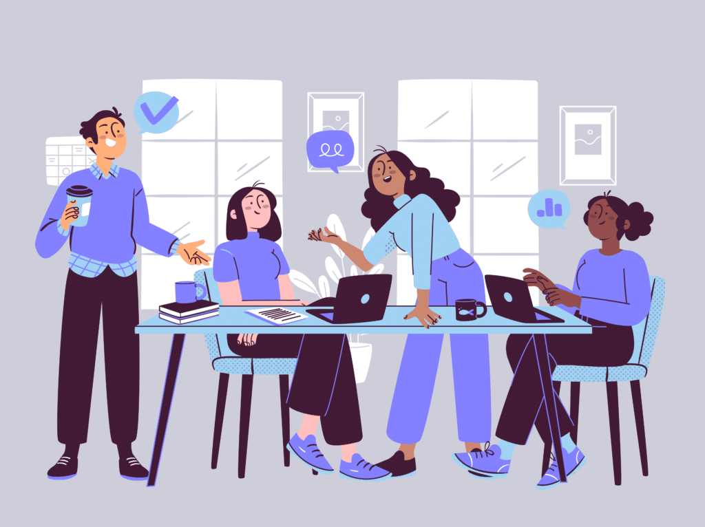 AI Recruitment Tools: What They Are and the Best Options for Hiring 2 Employees at a table with laptops