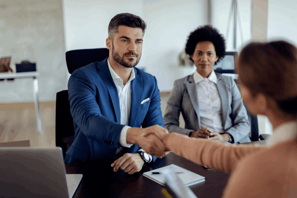 How to Recruit Financial Advisors: Essential Financial Advisor Skills & Strategies 4 A man handshaking a woman