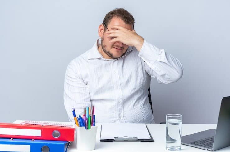 7 Mistakes Aussie TA Leaders Make When Skills Testing 1 An exhausted hiring manager in his office