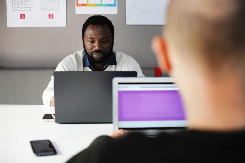 How to Prevent Cheating in Online Skills Assessments (and Why Fair AI Matters) 1 Two people using laptops