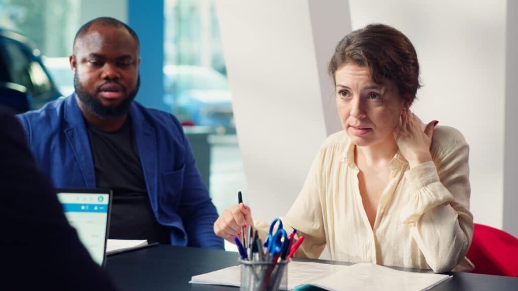 AI Bias in Hiring: How Smart TA Leaders Can Fix It 2 Colleagues discussing